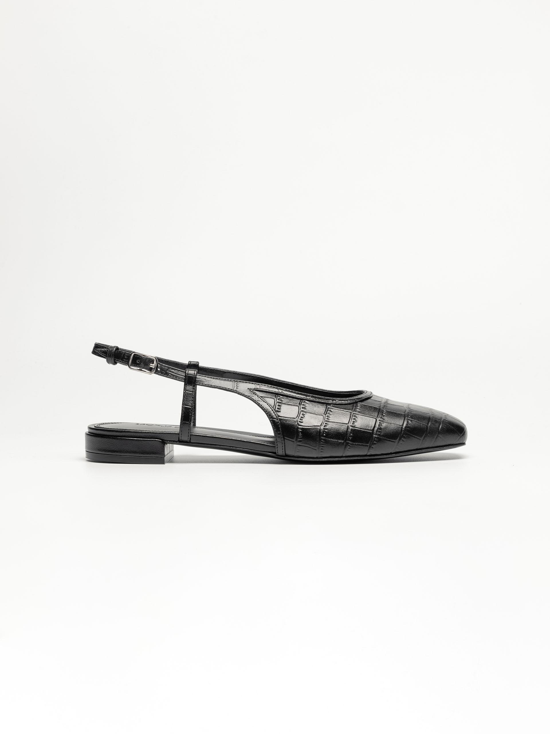 The Flat Slingback Black Embossed 1